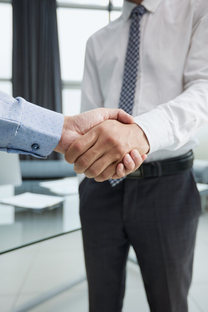 close up image of businesspeople shaking hand during the the meeting.